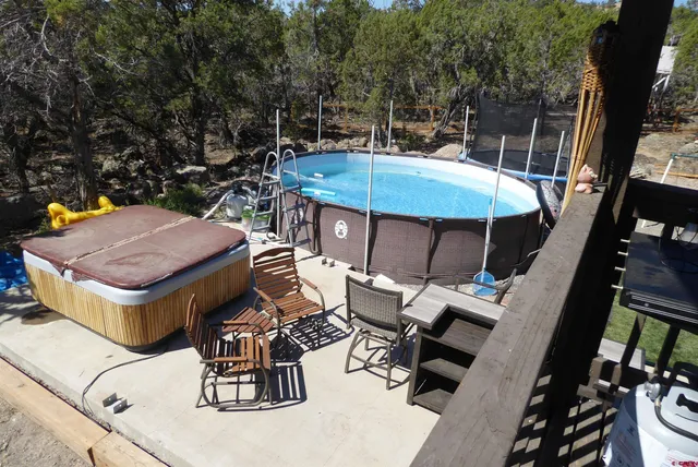 a view of a garden with sitting area
