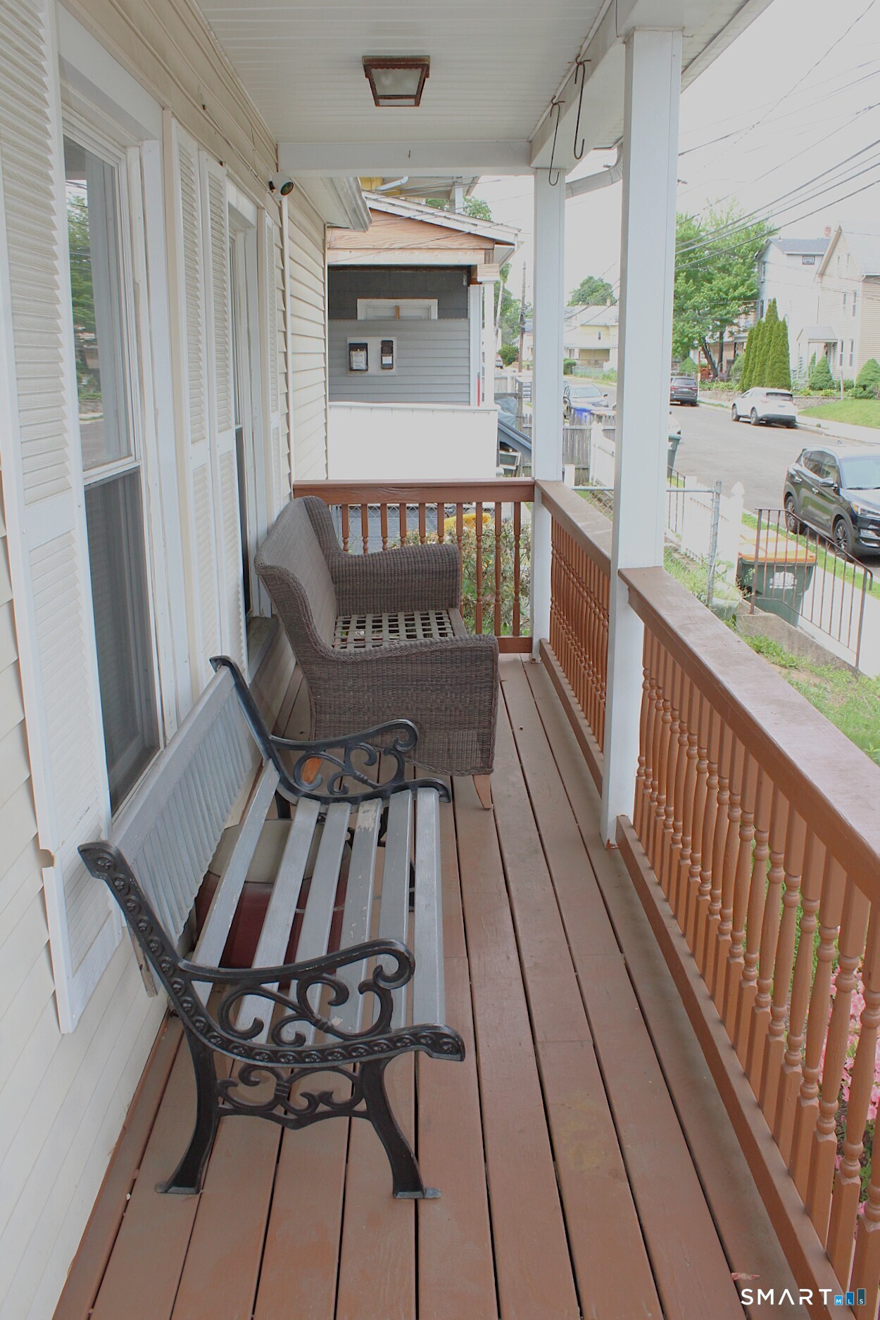 90 Franklin Street Meriden, CT 06450 - Photo 2 of 40 a view of a balcony with furniture and wooden floor