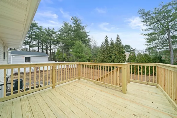 a view of deck with wooden floor and fence
