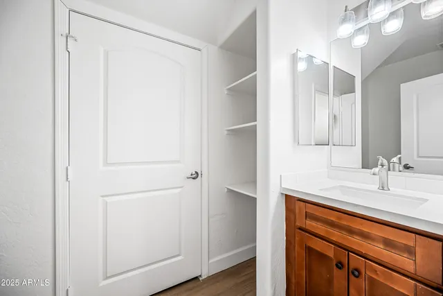 a bathroom with a shower and a sink