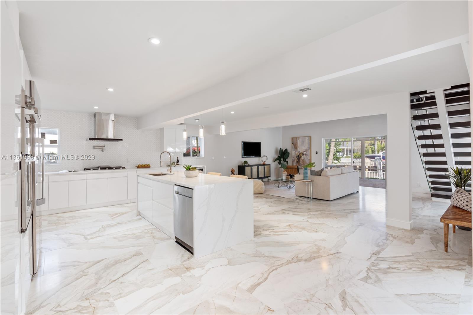 721 Southwest 15th Street Boca Raton, FL 33486 - Photo 21 of 46 a view of kitchen with sink and living room
