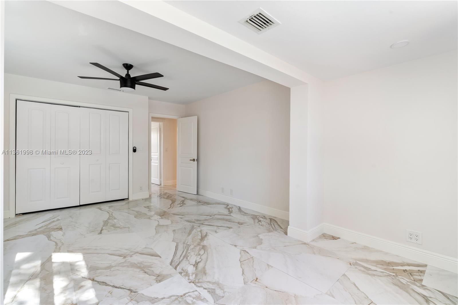 721 Southwest 15th Street Boca Raton, FL 33486 - Photo 24 of 46 a view of empty room with a ceiling fan
