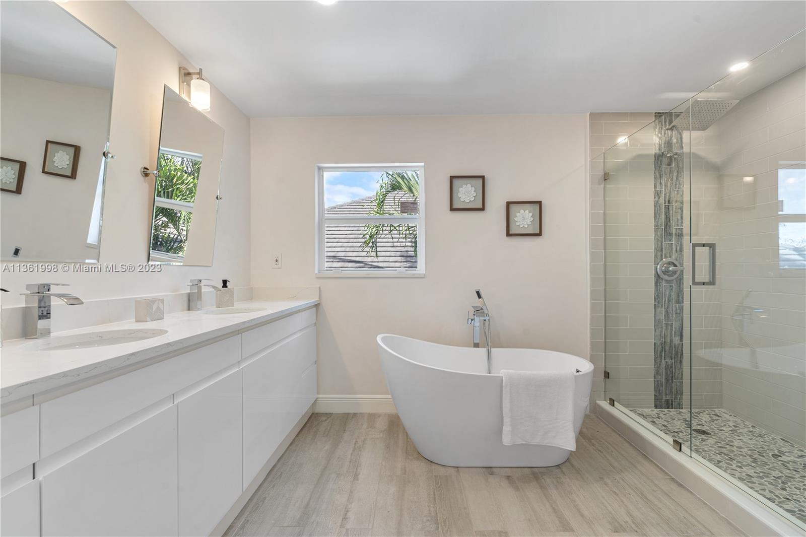 721 Southwest 15th Street Boca Raton, FL 33486 - Photo 36 of 46 a bathroom with a sink and a bathtub