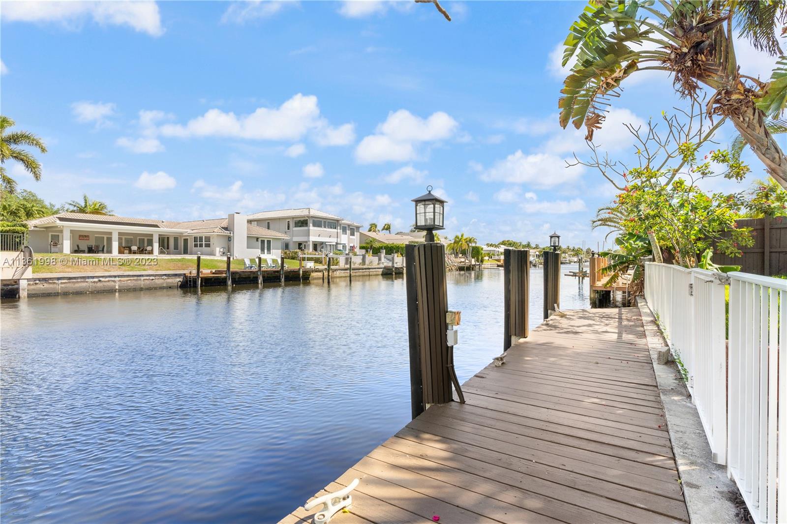 721 Southwest 15th Street Boca Raton, FL 33486 - Photo 40 of 46 a view of a lake with boats and trees in the background