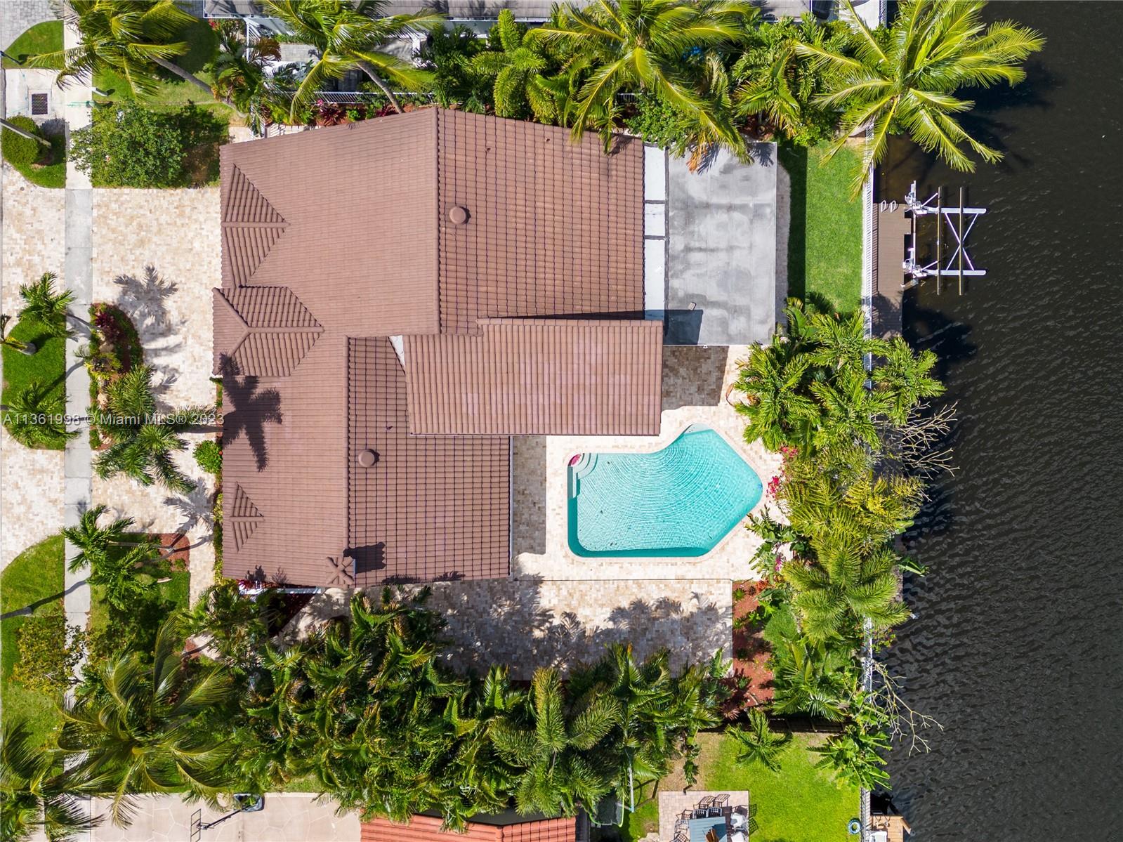 721 Southwest 15th Street Boca Raton, FL 33486 - Photo 42 of 46 an aerial view of a house with a garden and plants