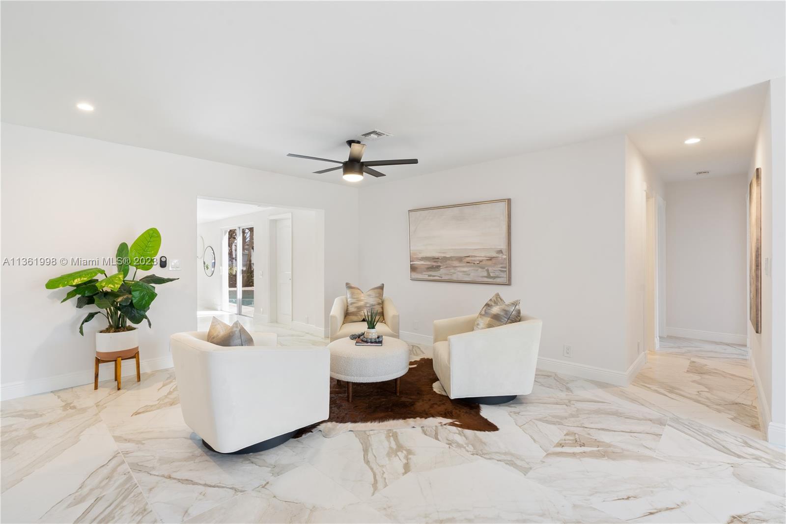 721 Southwest 15th Street Boca Raton, FL 33486 - Photo 6 of 46 a living room with furniture and a potted plant