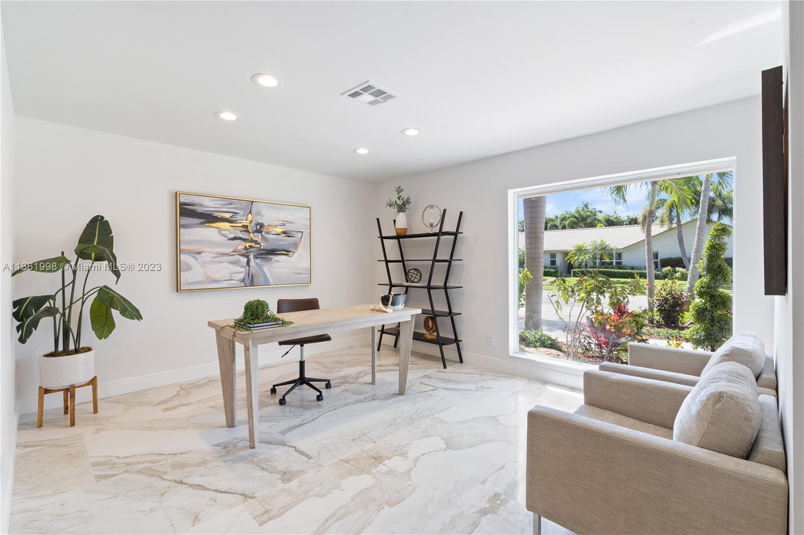 721 Southwest 15th Street Boca Raton, FL 33486 - Photo 7 of 46 a living room with furniture a window and a flat screen tv