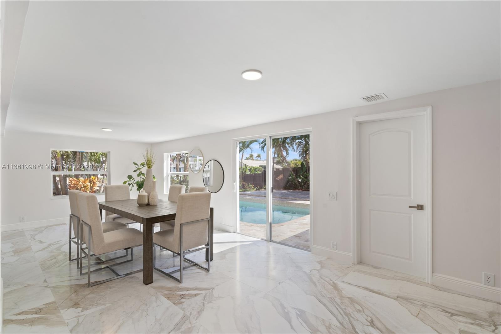 721 Southwest 15th Street Boca Raton, FL 33486 - Photo 10 of 46 a view of a workspace with furniture and a window