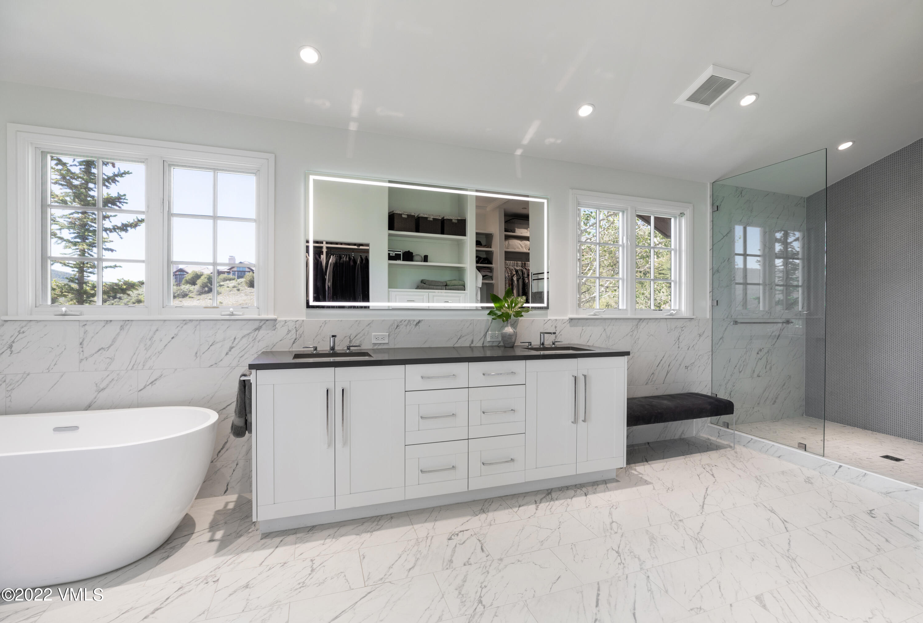 100 Casteel Ridge Edwards, CO 81632 - Photo 11 of 36 a spacious bathroom with a granite countertop tub sink and mirror
