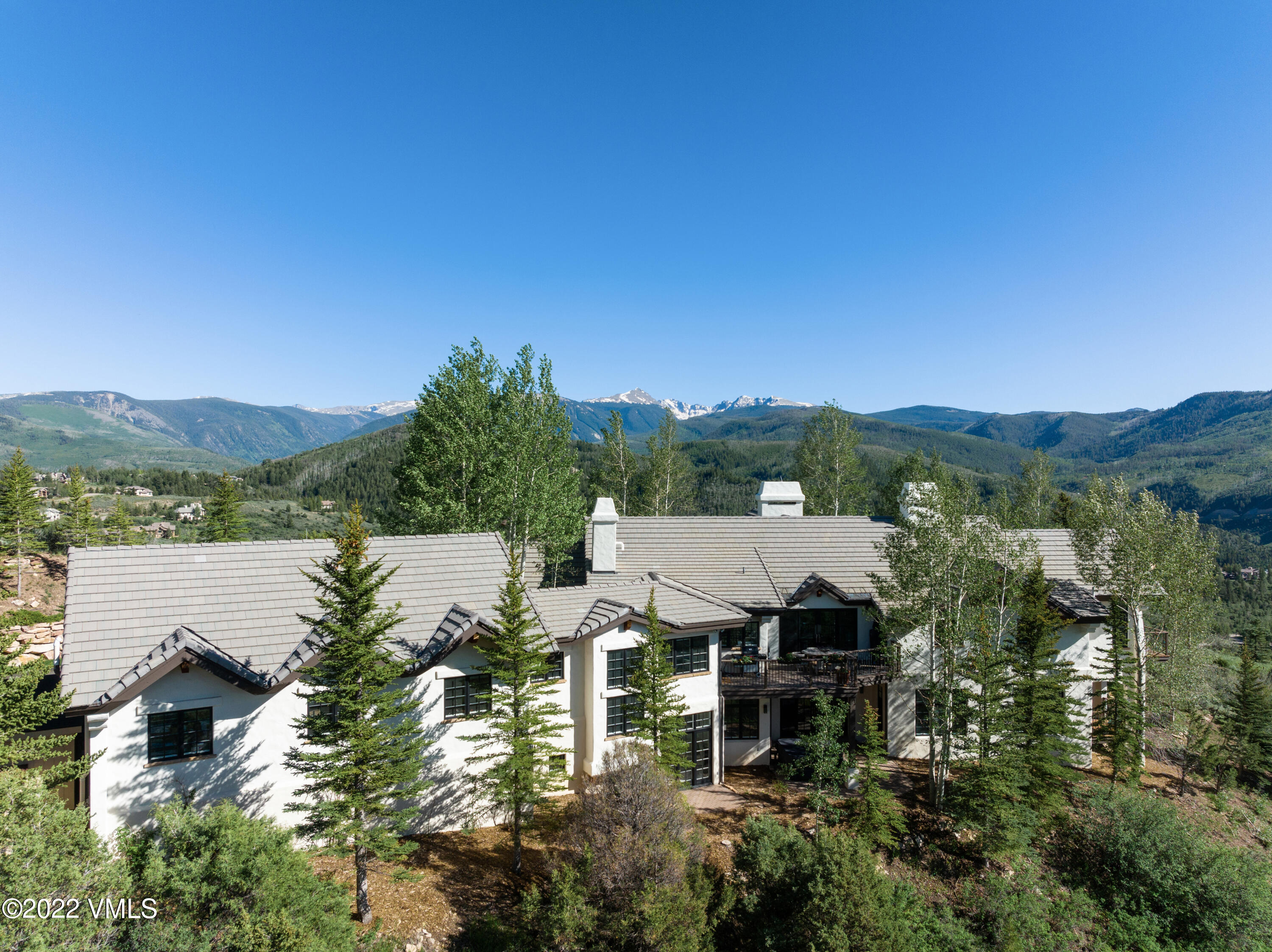 100 Casteel Ridge Edwards, CO 81632 - Photo 13 of 36 an aerial view of a house with a yard lake and outdoor seating