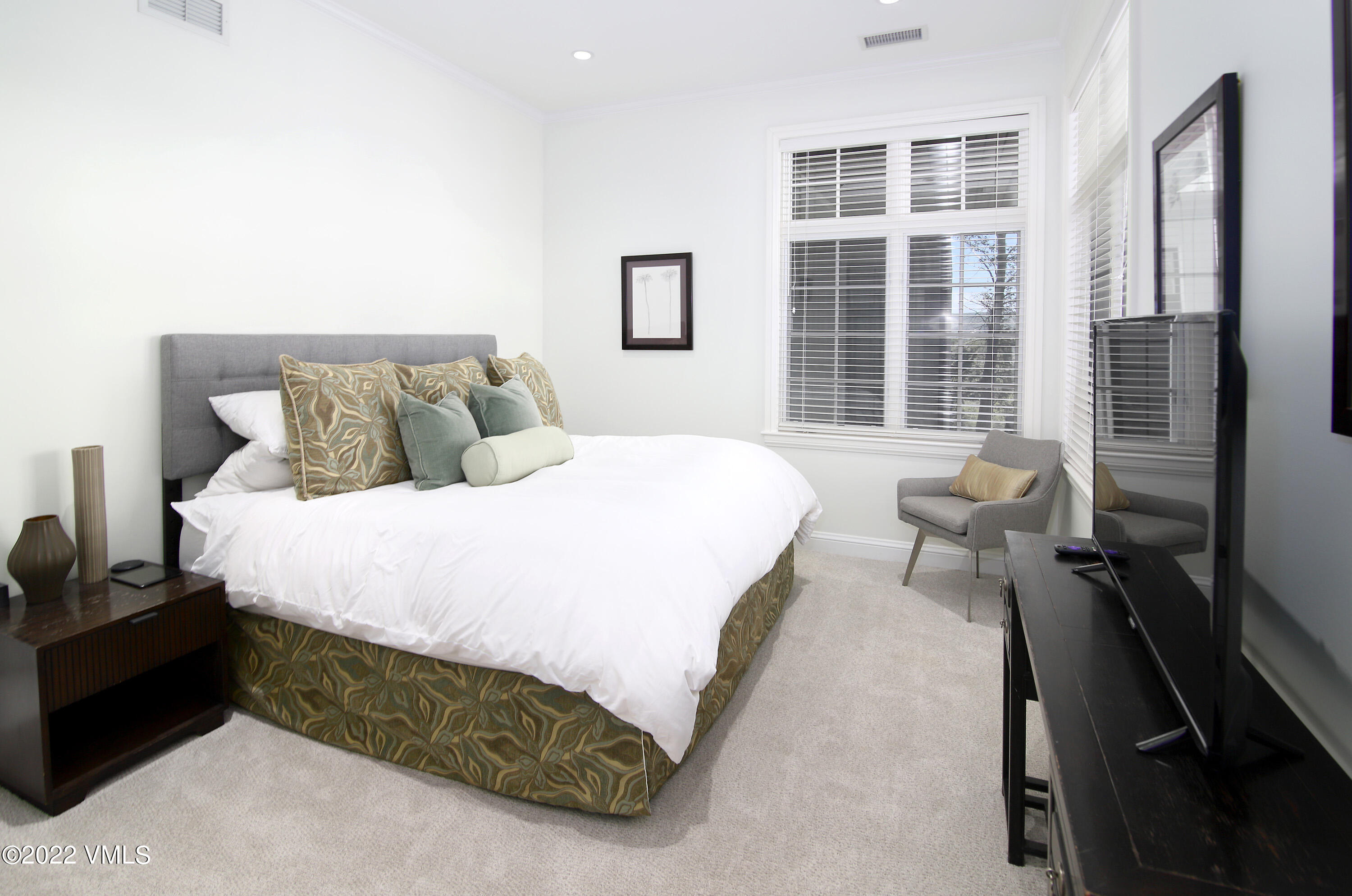 100 Casteel Ridge Edwards, CO 81632 - Photo 18 of 36 a spacious bedroom with a bed and a window