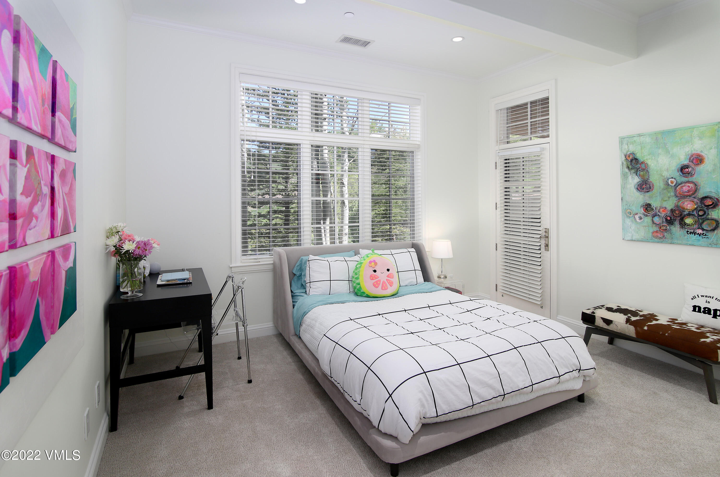 100 Casteel Ridge Edwards, CO 81632 - Photo 19 of 36 a bedroom with a bed and a potted plant