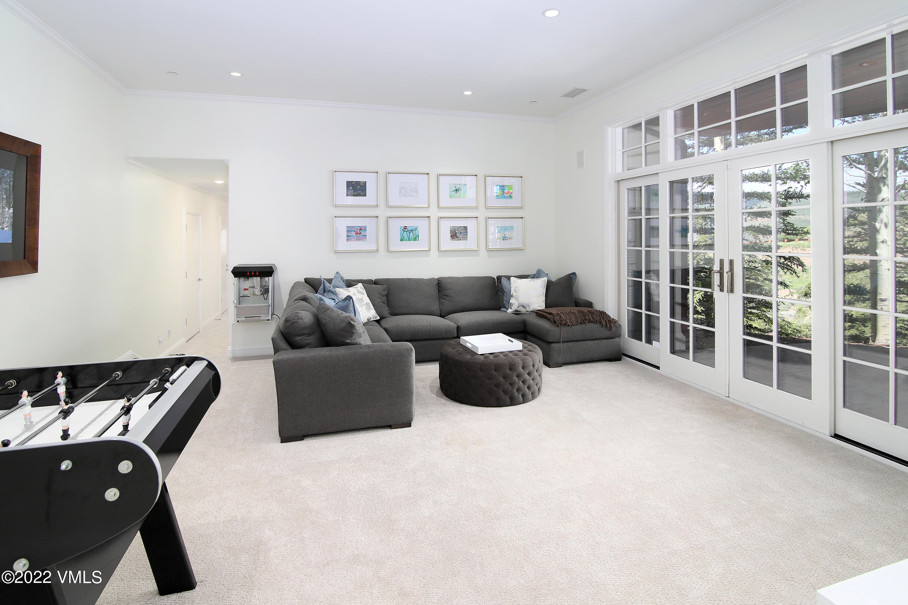 100 Casteel Ridge Edwards, CO 81632 - Photo 26 of 36 a living room with furniture and a floor to ceiling window