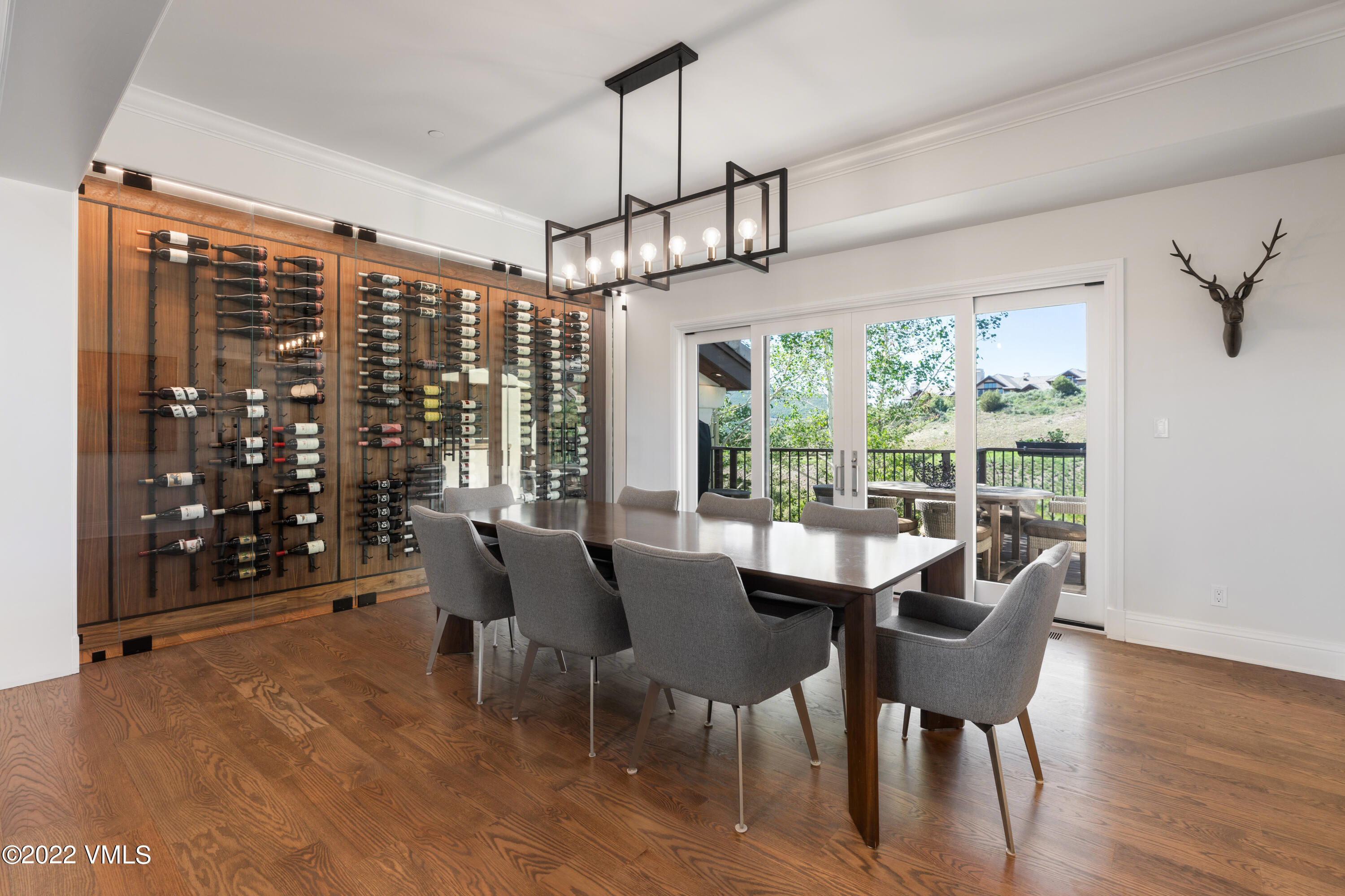 100 Casteel Ridge Edwards, CO 81632 - Photo 7 of 36 a view of a dining room with furniture window and wooden floor