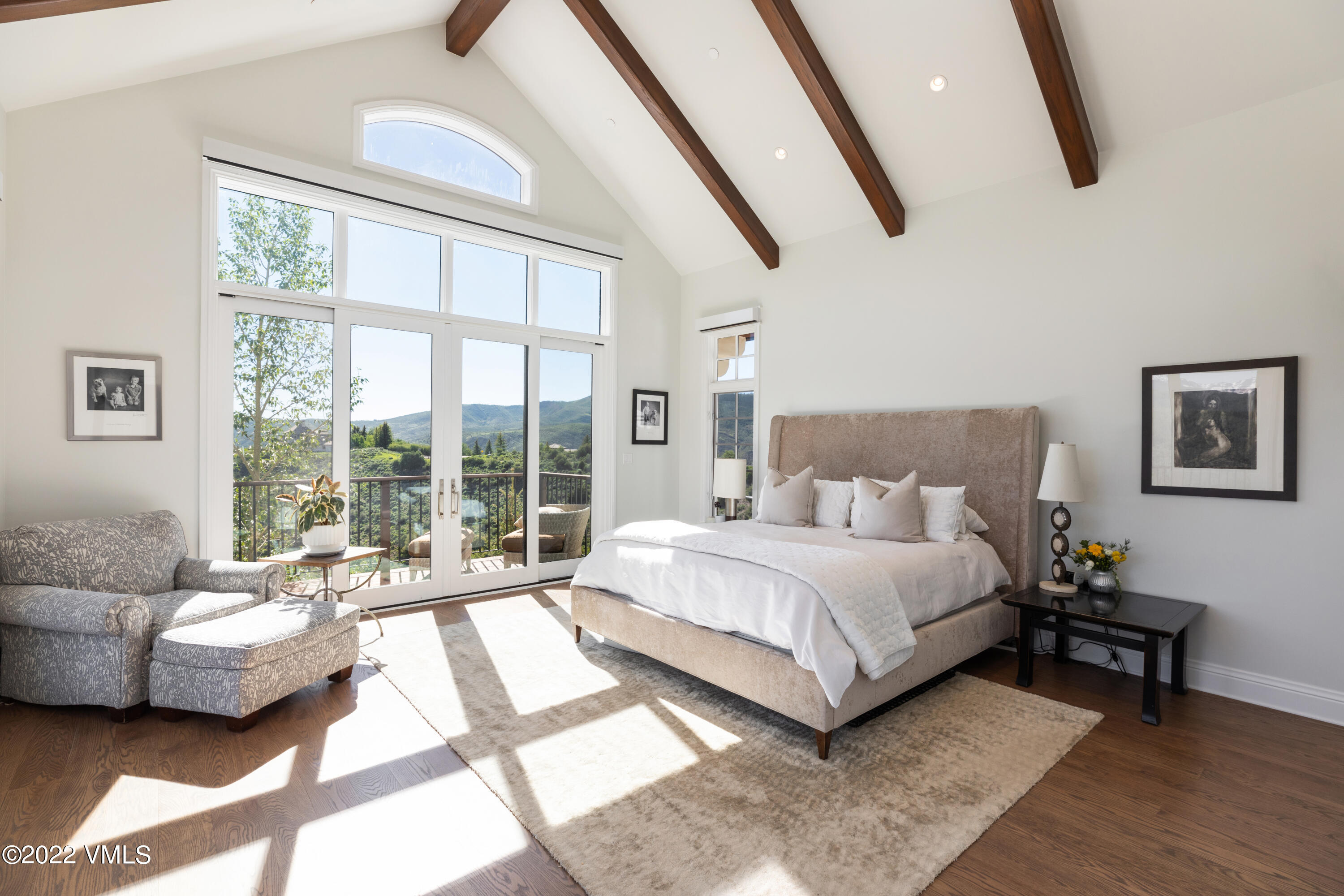 100 Casteel Ridge Edwards, CO 81632 - Photo 9 of 36 a spacious bedroom with a bed and glass window