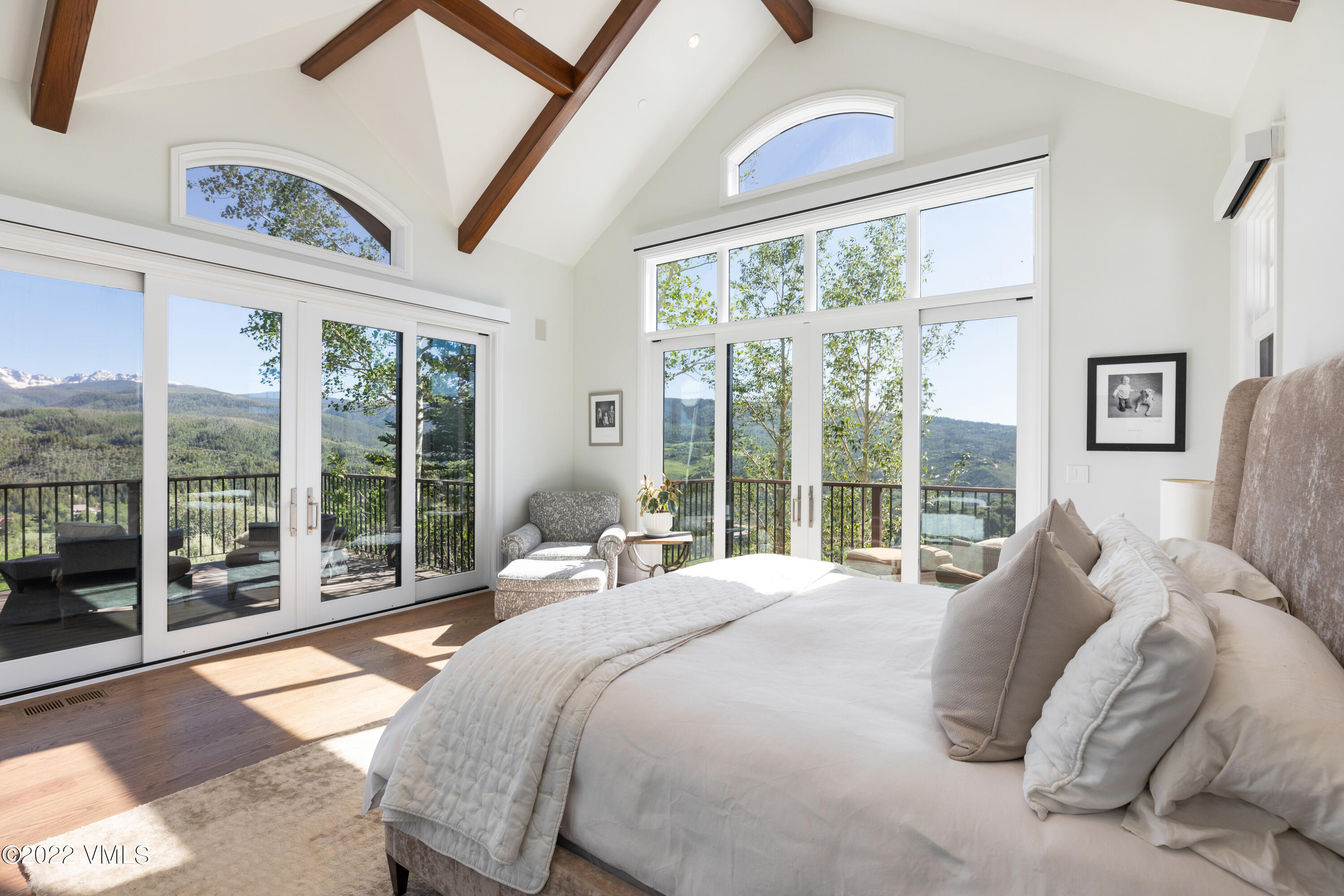 100 Casteel Ridge Edwards, CO 81632 - Photo 10 of 36 a bedroom with a bed and a large window