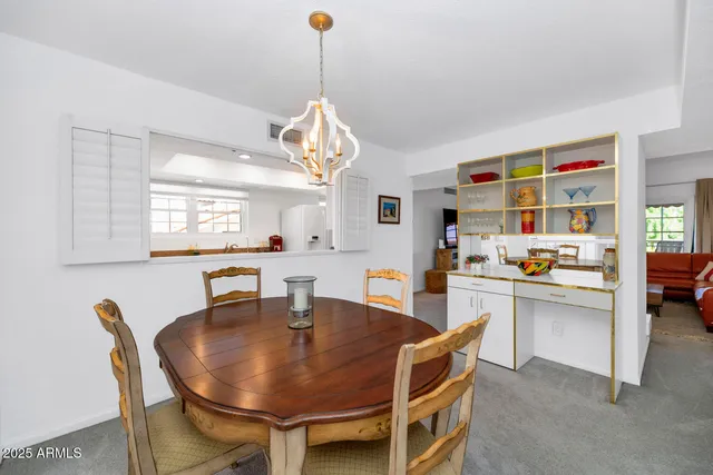 a dining room with furniture and window