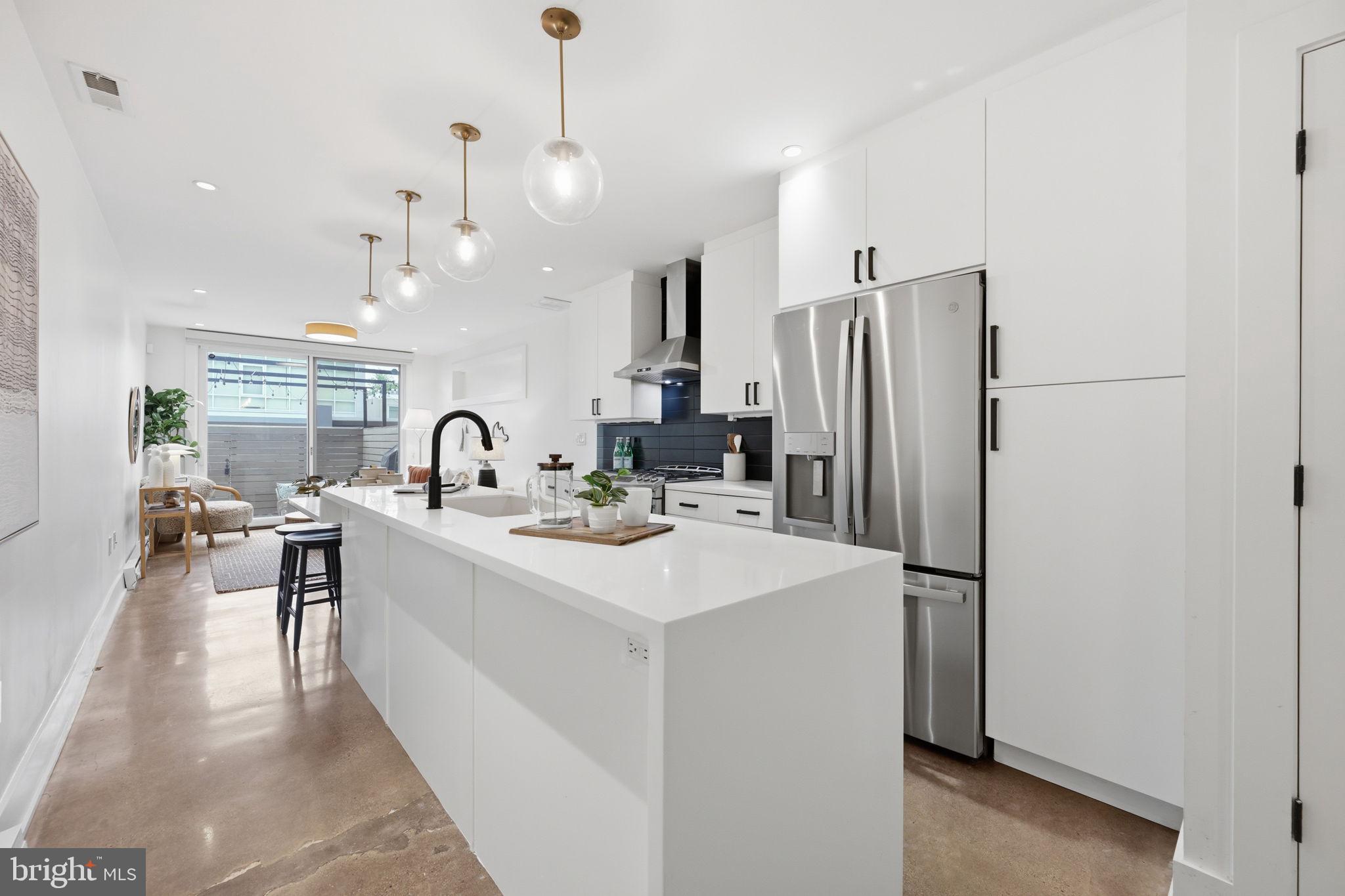 445 Ridge Street Northwest Washington, DC 20001 - Photo 3 of 39 Sleek modern kitchen with bright accents.