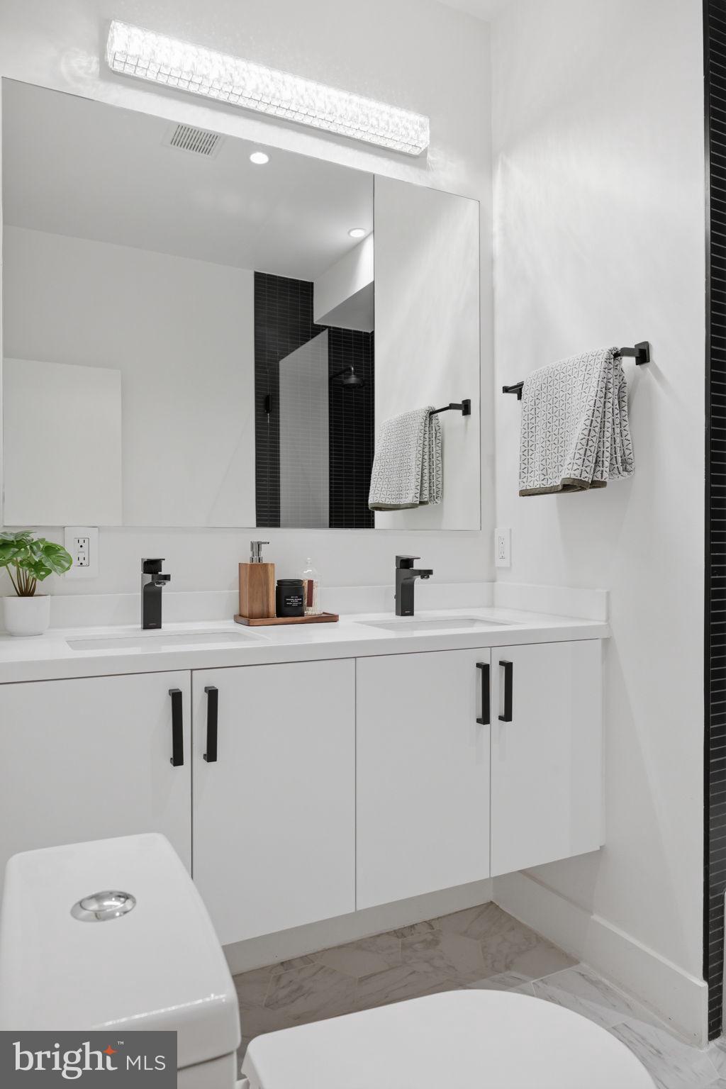 445 Ridge Street Northwest Washington, DC 20001 - Photo 34 of 39 Sleek modern bathroom with elegant finishes.