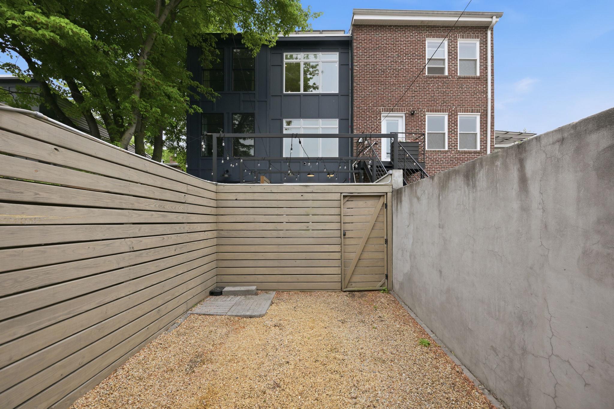 445 Ridge Street Northwest Washington, DC 20001 - Photo 38 of 39 Entrance from Secure Parking to the Back Yard