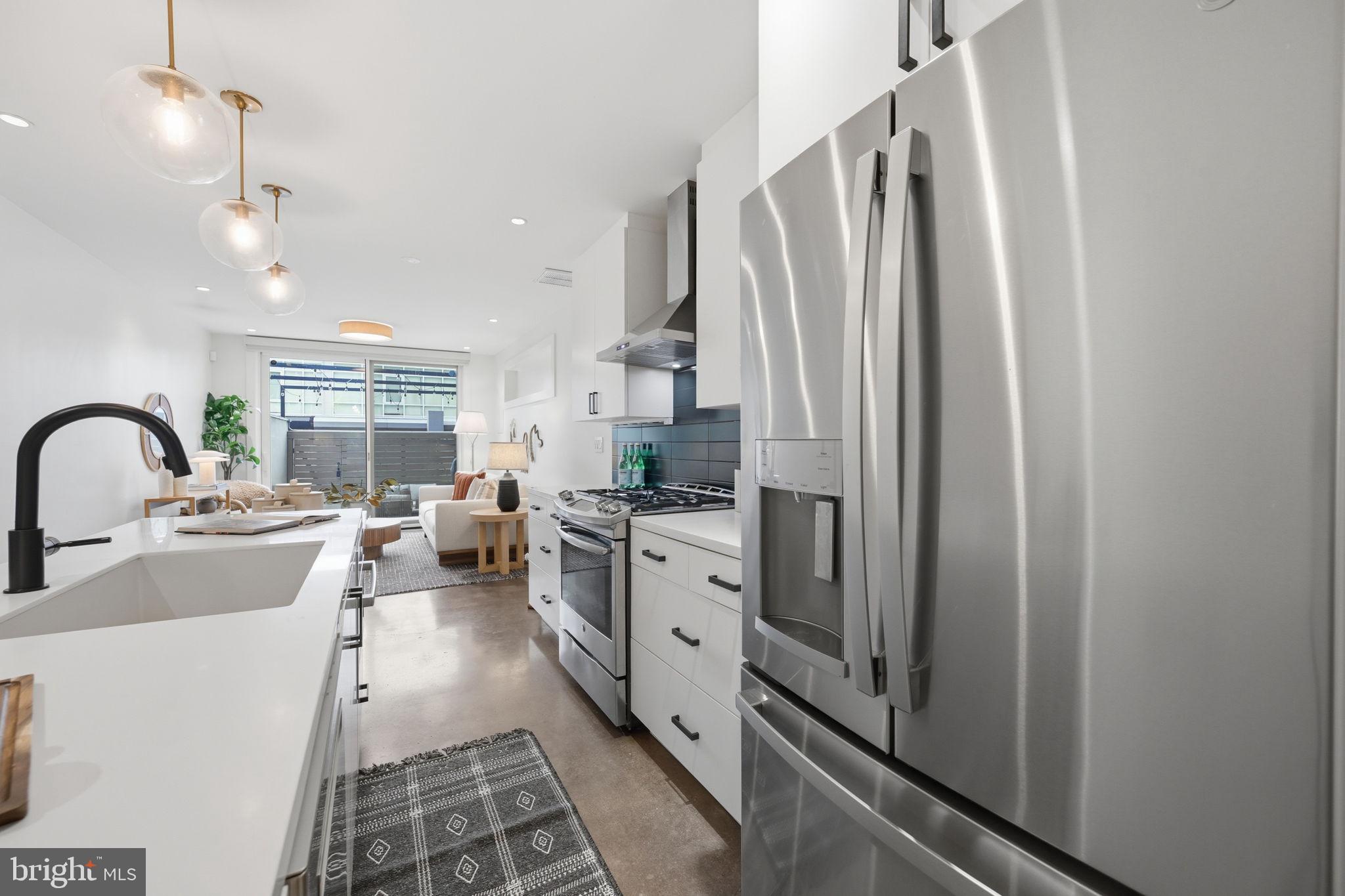 445 Ridge Street Northwest Washington, DC 20001 - Photo 6 of 39 Sleek modern kitchen with natural light.