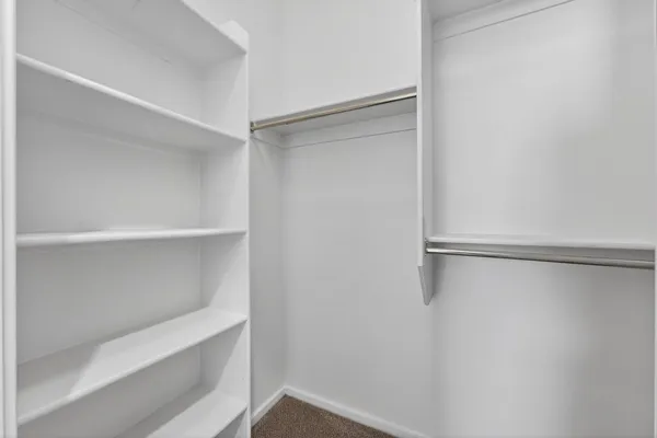 a view of an empty walk in closet