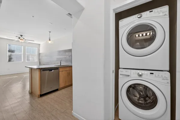 a view of a kitchen with a washer and dryer