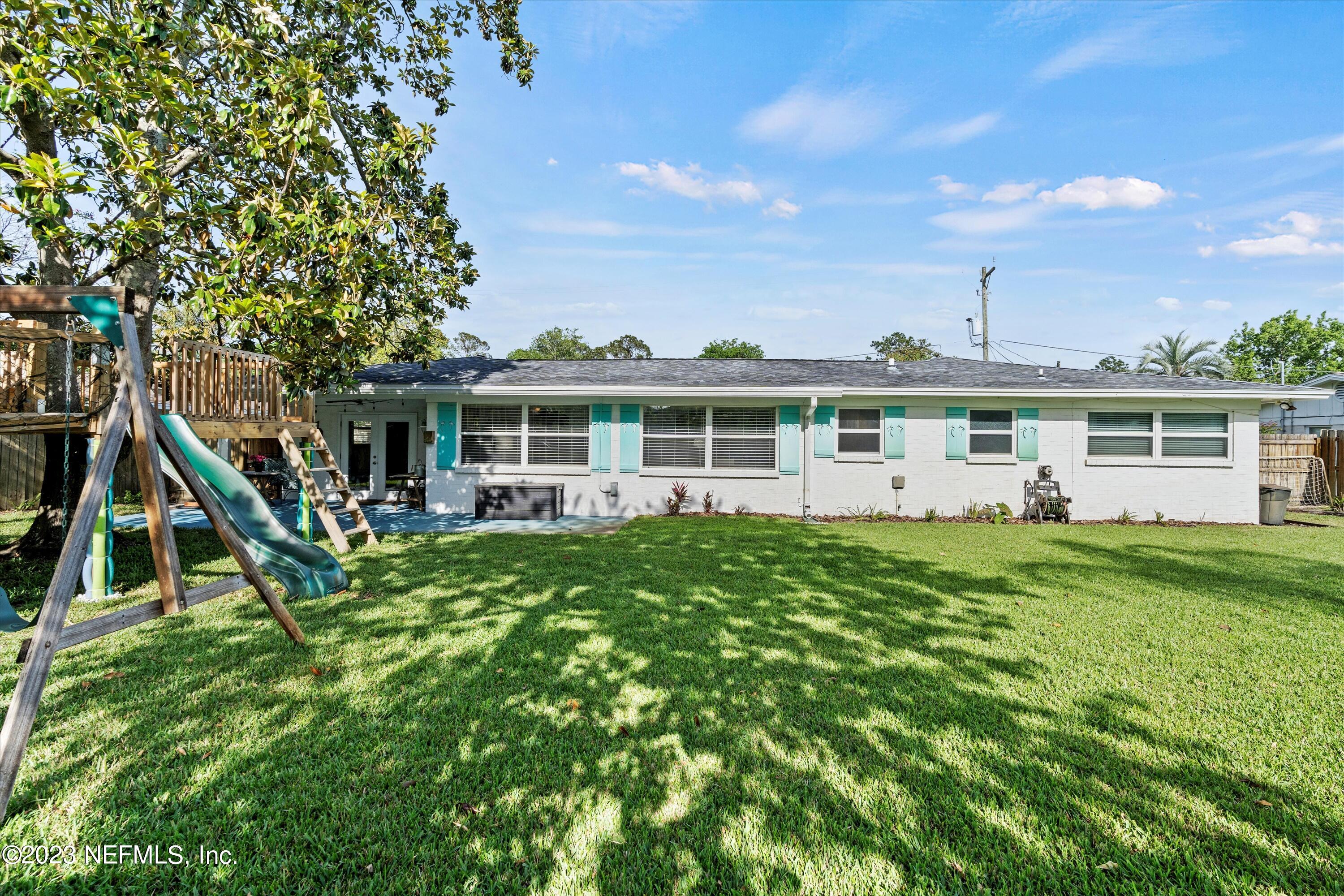 3972 Eunice Road Jacksonville, FL 32250 - Photo 30 of 38 a view of a house with pool and sitting area