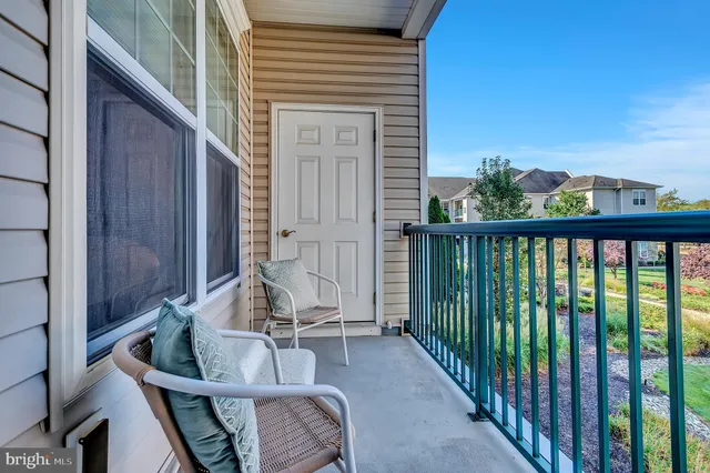 a view of balcony with furniture