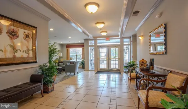 a lobby with furniture and wooden floor