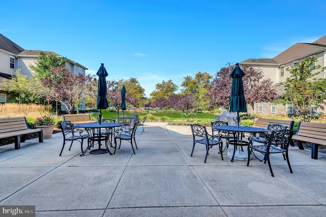 a view of a chairs and table in the patio