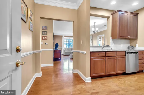 a very nice looking room with a large mirror and cabinets
