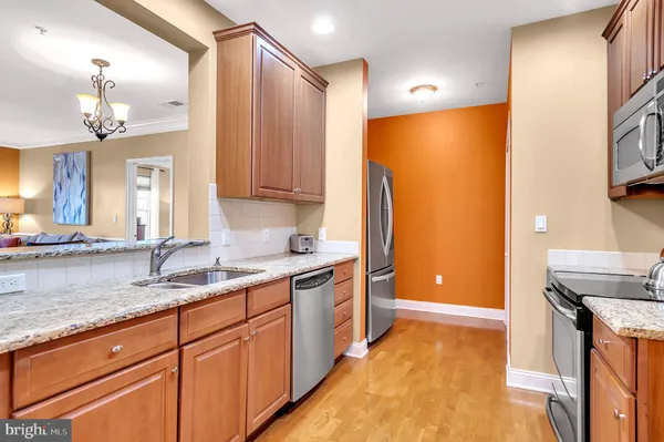 a kitchen with a sink and a refrigerator