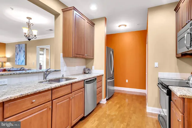 a kitchen with a sink and a refrigerator