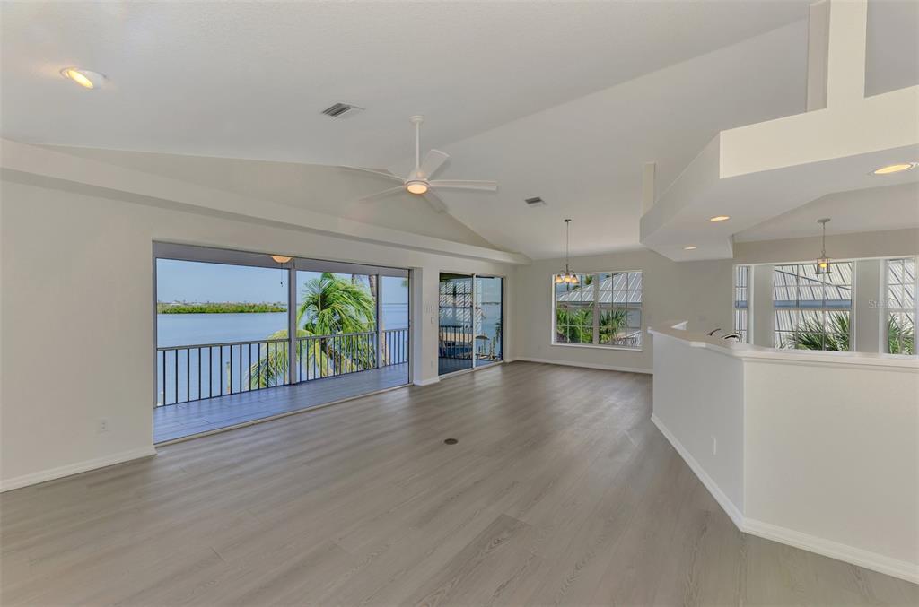 1380 Beach Road, Unit 4 Englewood, FL 34223 - Photo 15 of 47 a view of an empty room with wooden floor and a window
