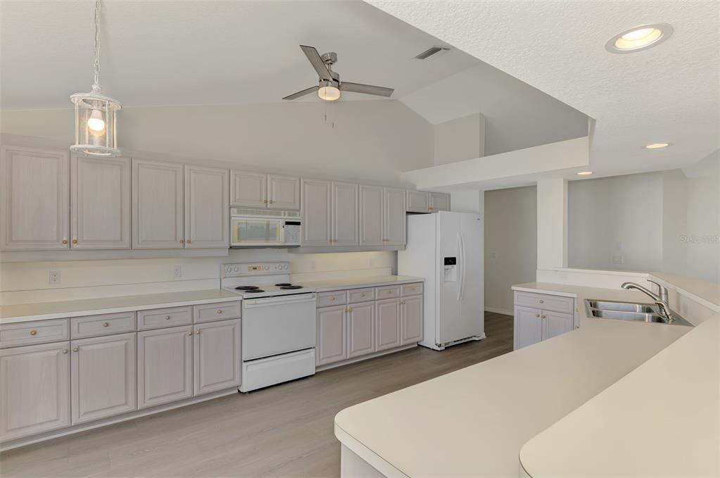 1380 Beach Road, Unit 4 Englewood, FL 34223 - Photo 20 of 47 a room with a sink a bed and furniture
