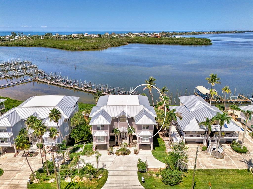 1380 Beach Road, Unit 4 Englewood, FL 34223 - Photo 2 of 47 an aerial view of a house with a lake view