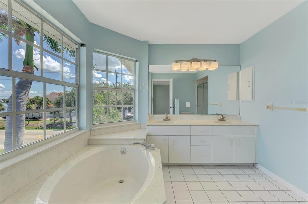 1380 Beach Road, Unit 4 Englewood, FL 34223 - Photo 28 of 47 a large bathroom with a large tub and sink