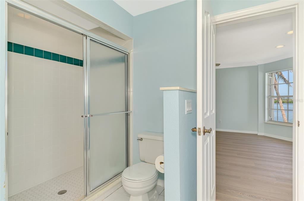 1380 Beach Road, Unit 4 Englewood, FL 34223 - Photo 29 of 47 a bathroom with a shower and a toilet