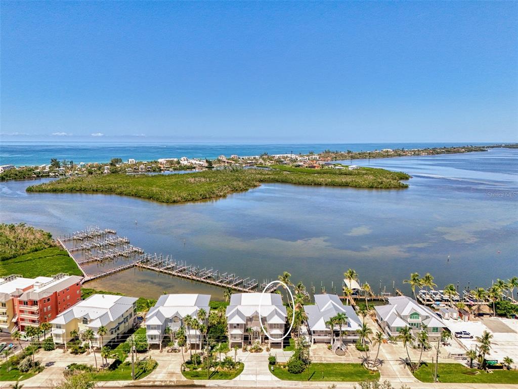 1380 Beach Road, Unit 4 Englewood, FL 34223 - Photo 3 of 47 an aerial view of ocean and residential houses with outdoor space