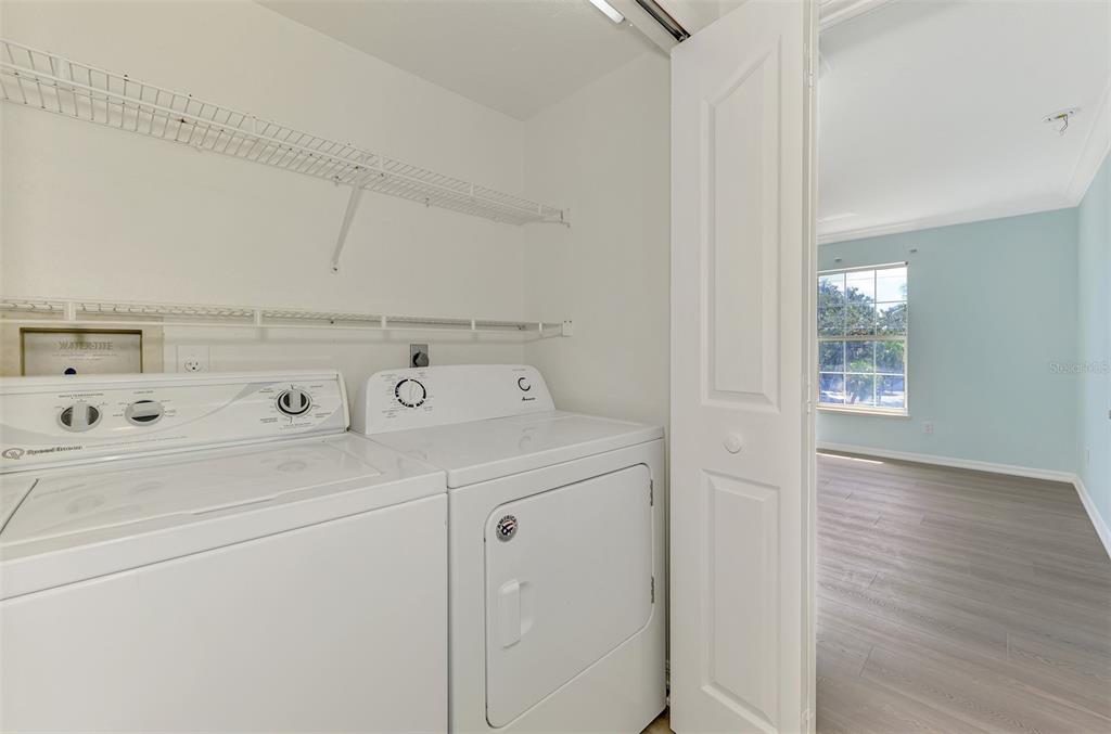 1380 Beach Road, Unit 4 Englewood, FL 34223 - Photo 35 of 47 a utility room with dryer and washer