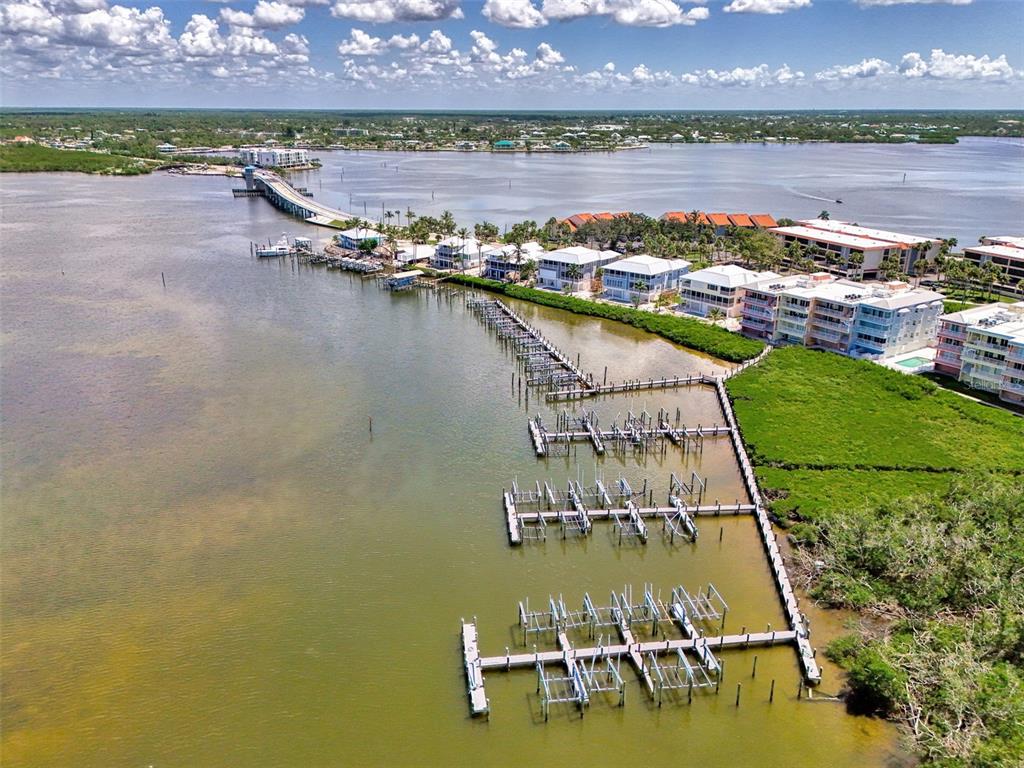 1380 Beach Road, Unit 4 Englewood, FL 34223 - Photo 40 of 47 a view of a city with lawn chairs