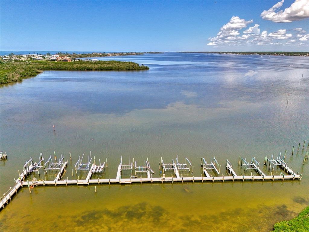 1380 Beach Road, Unit 4 Englewood, FL 34223 - Photo 47 of 47 a view of a lake with boats in the background