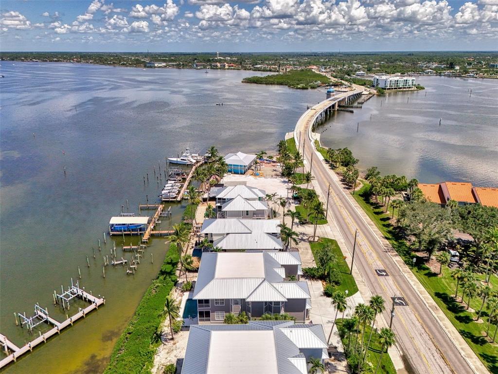 1380 Beach Road, Unit 4 Englewood, FL 34223 - Photo 5 of 47 an aerial view of a house with a garden and lake view