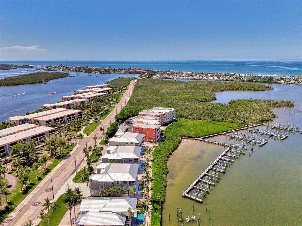 1380 Beach Road, Unit 4 Englewood, FL 34223 - Photo 6 of 47 a view of a city and ocean view