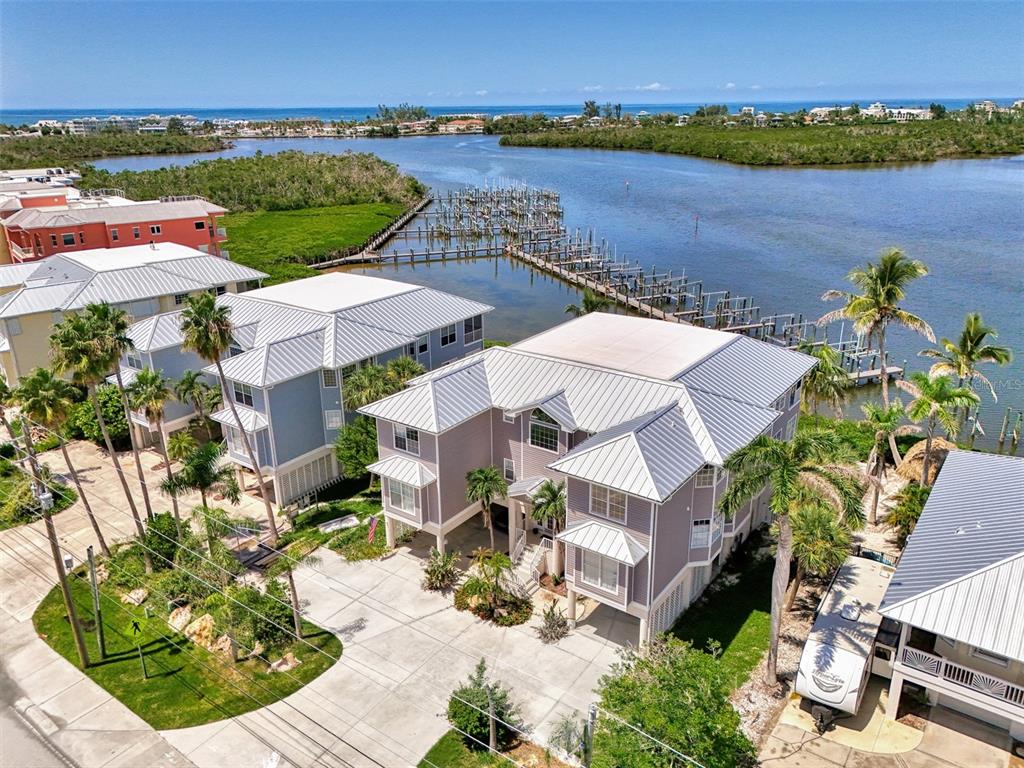 1380 Beach Road, Unit 4 Englewood, FL 34223 - Photo 8 of 47 an aerial view of a house with outdoor space and lake view