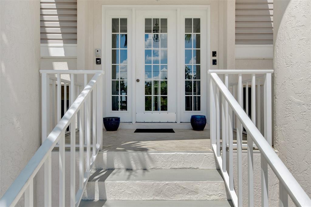 1380 Beach Road, Unit 4 Englewood, FL 34223 - Photo 10 of 47 a view of staircase with lots of windows and plants