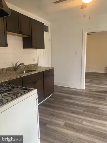 a kitchen with stainless steel appliances granite countertop a stove and a microwave