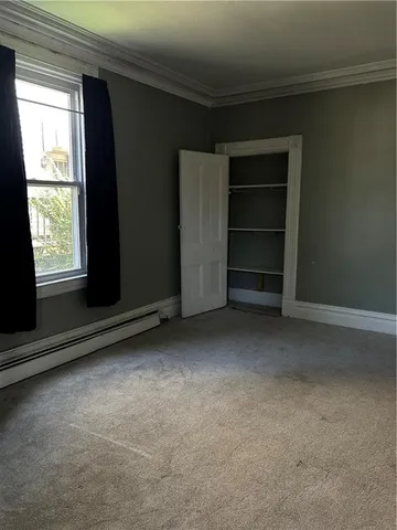 a view of room with a flat screen tv and a window