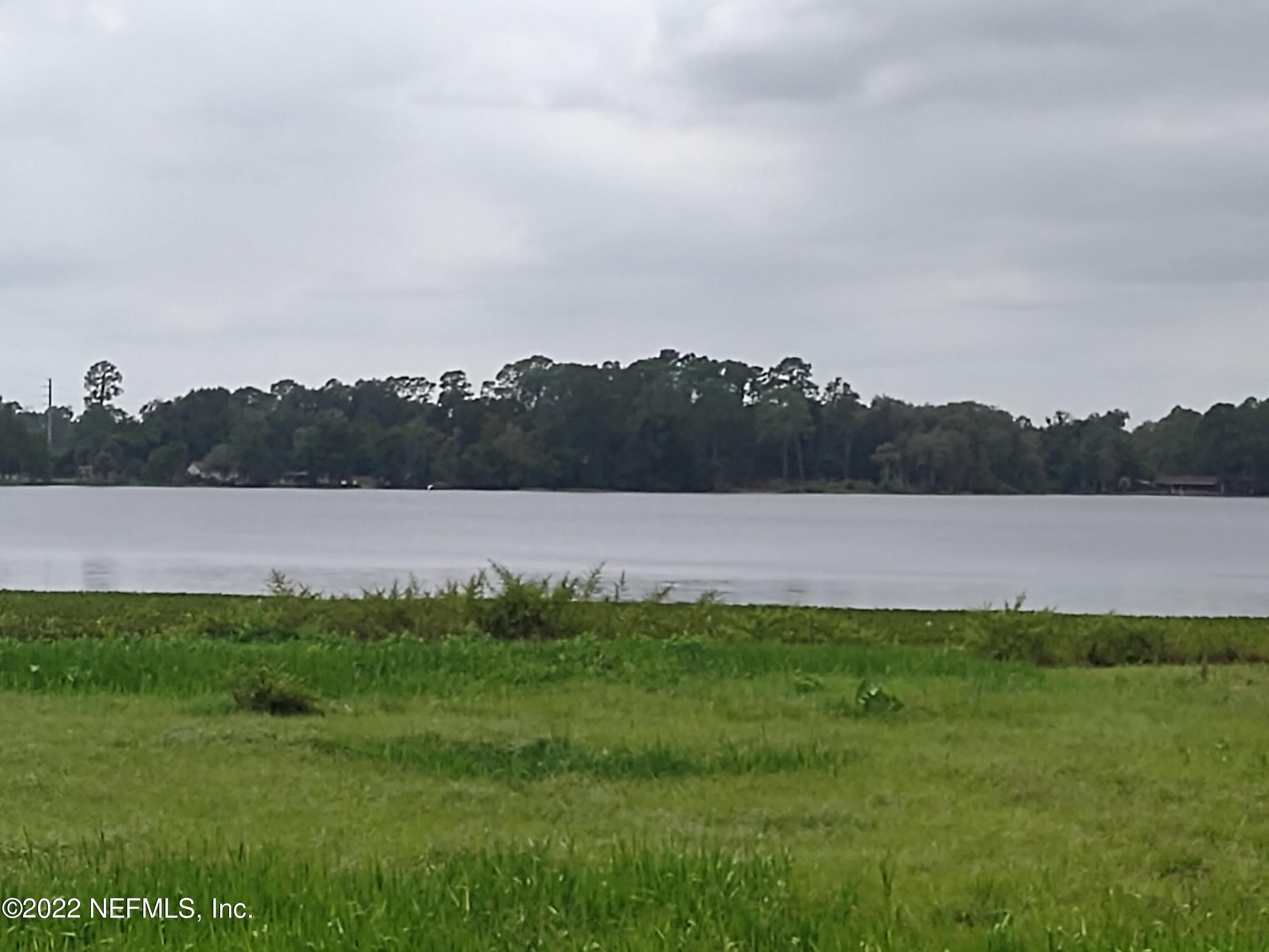 73 Ida Boulevard Interlachen, FL 32148 - Photo 2 of 6 a view of a lake with houses in the back